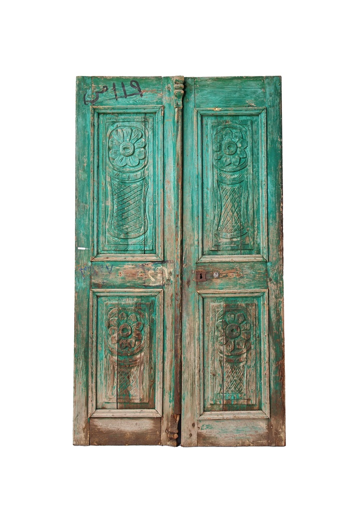 An antique door crafted from prized Azizi wood