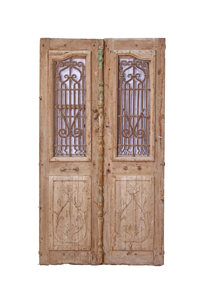door with a wrought iron grille