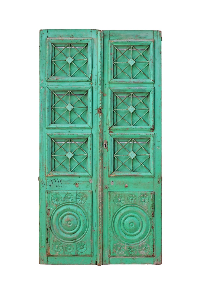  door with a wrought iron grille featuring geometric patterns