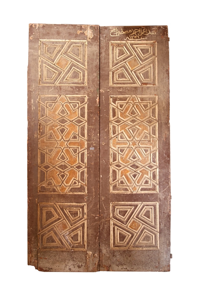 An antique door crafted from Azizi wood